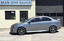 Grey 2017 Mitsubishi Lancer with dark privacy tint